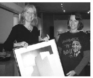 Passionate art collector Ann Nicklason drops off a piece for the Collector’s Choice Art Sale to Janice Mallman