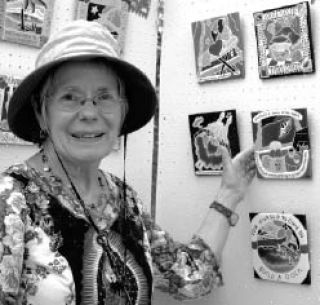 Irene Otis shows off a favorite of her tile works.