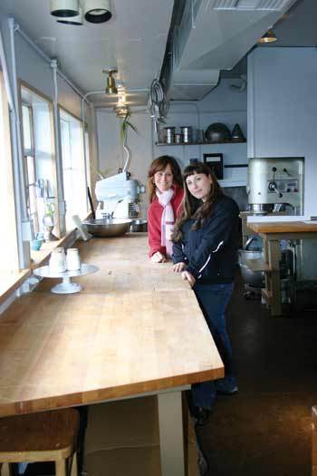 Mardi Ljubich and Nadia DAoust stand in the kitchen of Sound Food