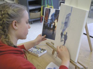 Emma Strong concentrates on creating a work of art.