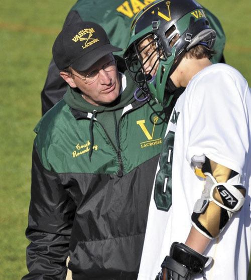 Charley Rosenberry talks with Griff Jennings during a game. Rosenberry retired from the club this year.