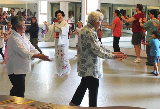 Anneli Fogt/Staff PhotoMary Mariko Ohno (center) leads islanders in a traditional Japanese Bon Odori dance during a workshop at the Blue Heron that took place last Sunday. Ohno will bring her students to the Strawberry Festival to perform on Saturday.