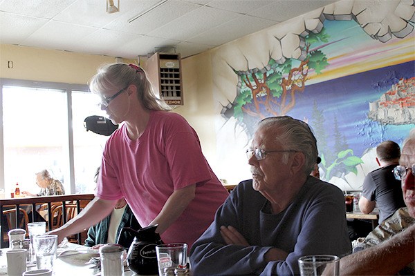 Waitress Dorothy Freye with lunch customers at Sporty's.