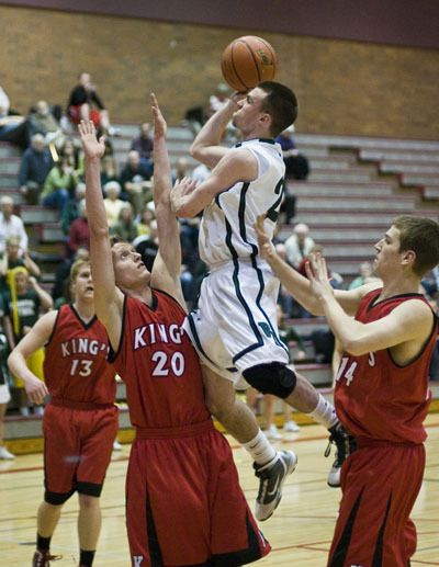 Matt Kerns attacks the basket in a crowd of King’s Knights.