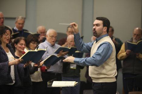 Vashon Island Chorale conductor Gary Cannon works with the 80-member ensemble during a rehearsal.