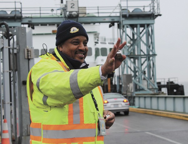 Bruce Brown greets commuters with a wave and a smile. He finds it easy to smile on Vashon