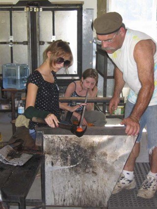 Brian Brenno works with teens on a glass project at his studio.