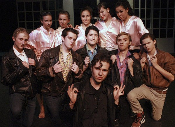 The cast of “Grease” includes boys (front) Keanu Roush and (second row left to right) Jeffrey Parrish