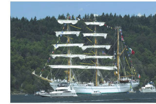 The Cuvavatemac leaves Quartermaster Harbor to participate in the Parade of Sails in 2005.