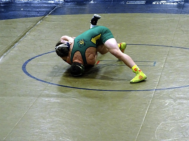 Courtesy PhotoLogan Nelson takes on his opponent during a meet last week.