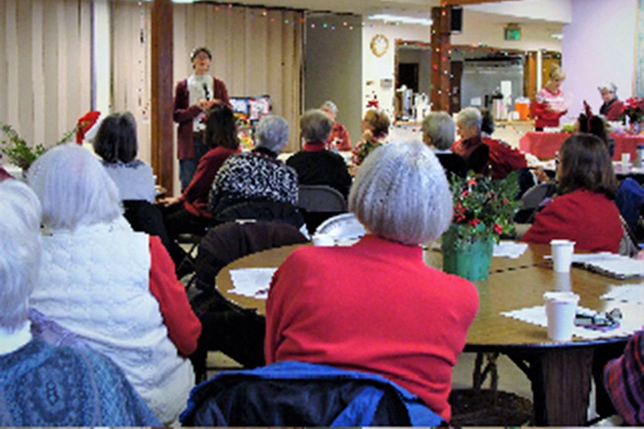 Vashon-Maury Island Garden Club members listen to leaders from local nonprofits before deciding which to volunteer for at Monday’s meeting. (Deborah Richards Photo)