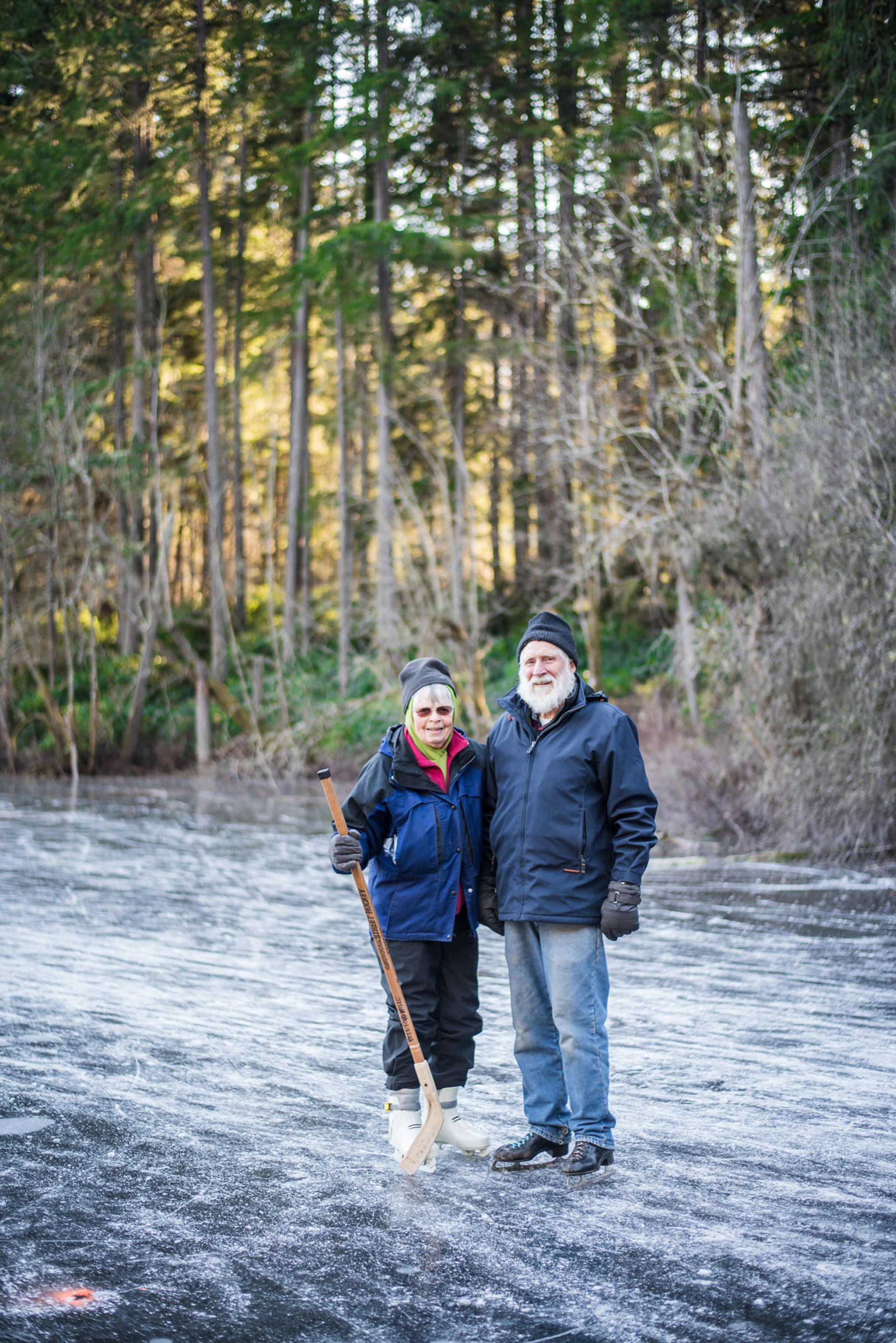 Gary and Linda Peterson — the island couple who has been providing ice skates for islanders when the pond freezes for years — stand on Fisher Pond. (Cassie Bergman Photo)