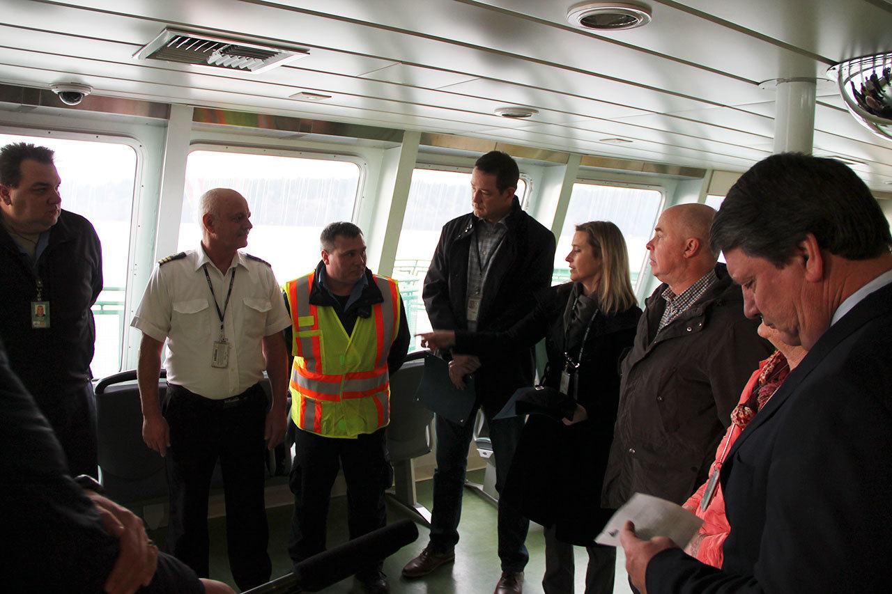 Left to right: Able Bodied Seaman Leonard Delong, Chief Mate Lee Burris, Able Bodied Seaman John Lohrey, Port Captain Jay Mooney, Port Captain Beth Stowell, Chetzemoka Captain Kelly Lippencott and Deputy Secretary of Transportation Keith Metcalf gather on the ferry Friday. (Anneli Fogt/Staff Photo)