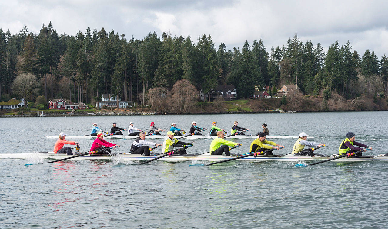 The juniors eight (back) passes the masters eight (front) during the Vashon Island Rowing Club’s annual Masters vs. Juniors Scrimmage to kick off the spring rowing season. (Jordan Petram Photo)