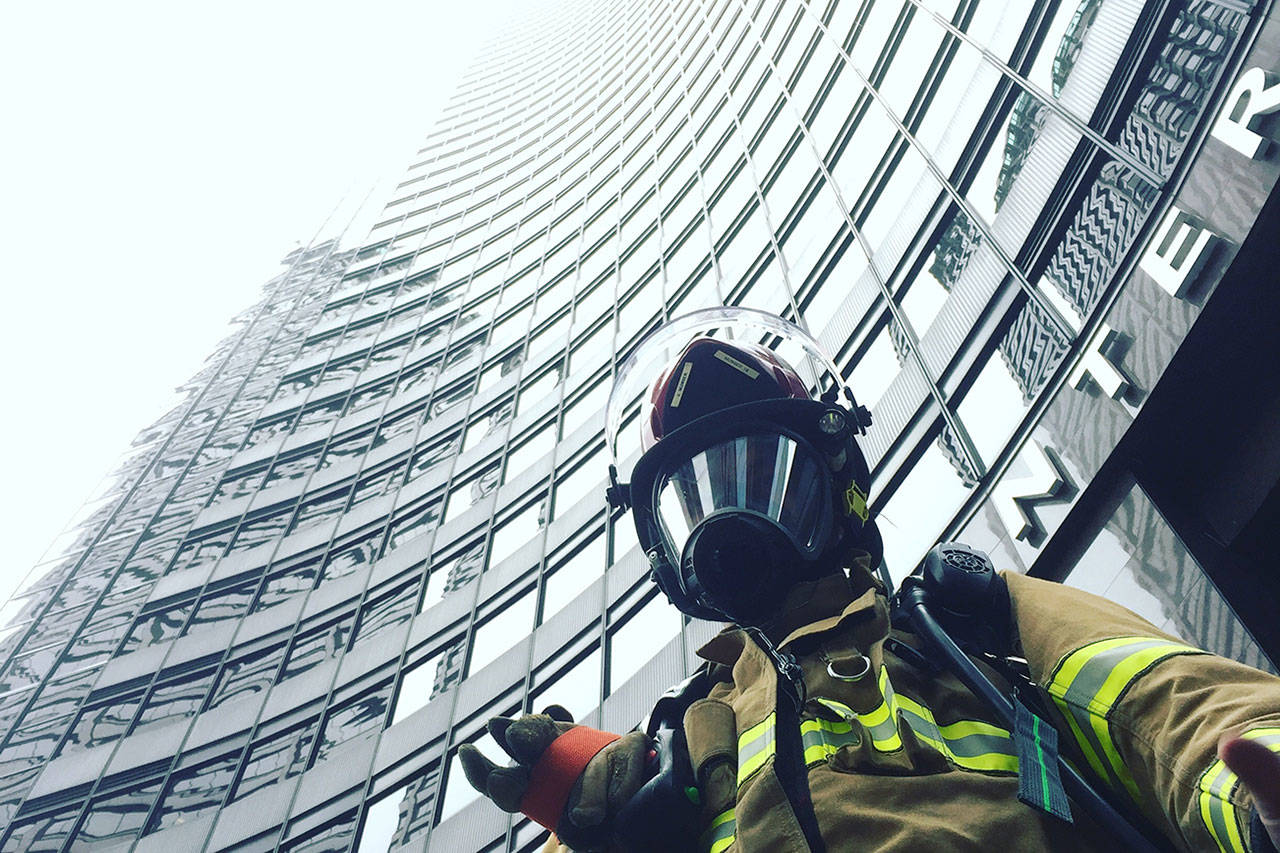 VIFR’s Josh Munger, who has competed in the event 12 times, stands at the base of the Columbia Center on Sunday. (Courtesy Photo)