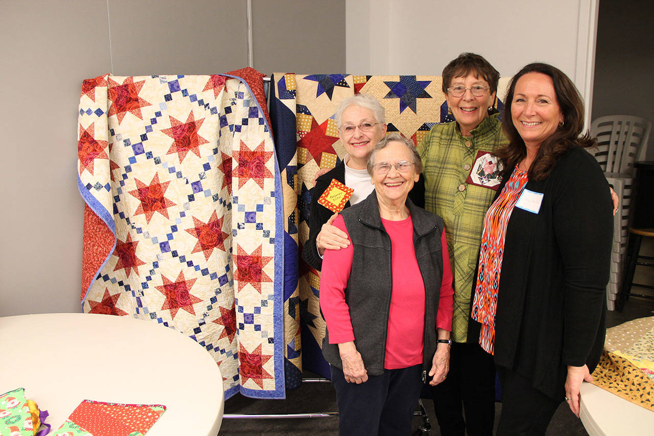 Vashon Island Quilt Guild members (clockwise from back left) Margaret Bickel, Marie “Toodie” Blichfeldt, Cindy Sheehan and Edee Eggert are just four of the many island quilters who have created quilts for charitable organizations locally and globally. (Anneli Fogt/Staff Photo)