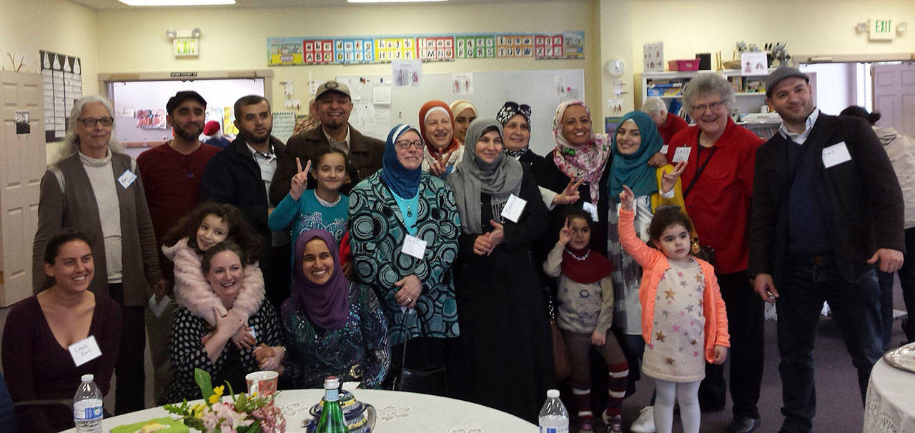 Vashon Resettlement Committee members and Muslim families who were guests at the Muslim Women Speak event on April 2. (Courtesy Photo)