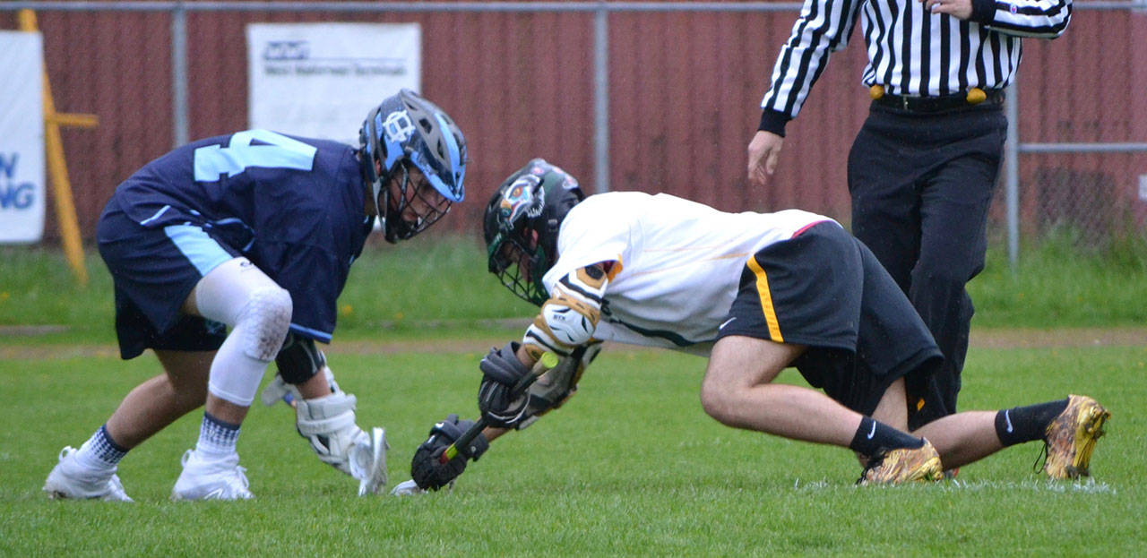 Senior Kellan Riley, right, excels at faceoffs, making him an invaluable addition to the team. (Greg Martin Photo)
