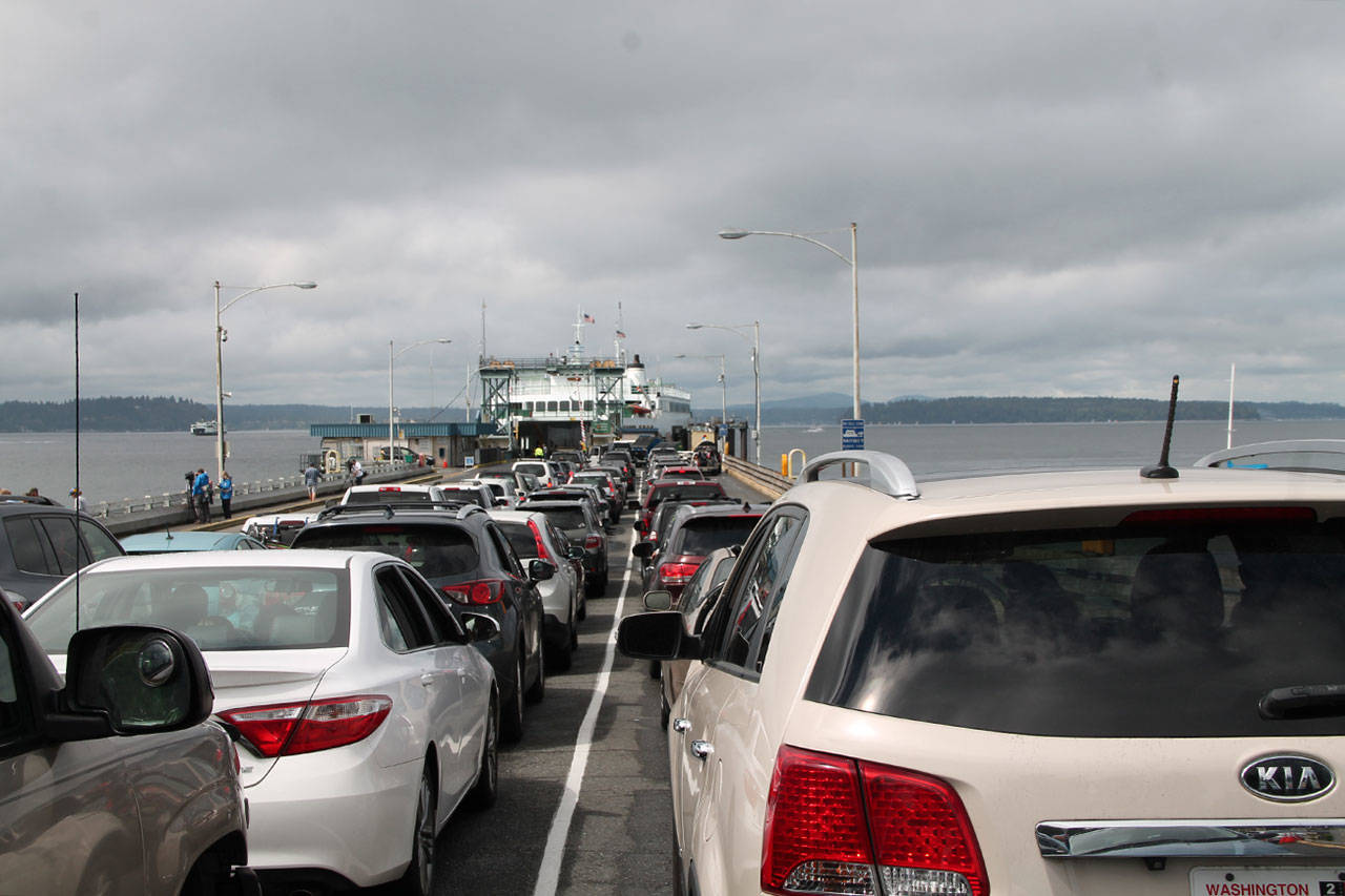 The Fauntleroy dock is packed with cars in this photo from August 2016, at the height of last year’s ferry frustrations. The changes being implemented next week are part of an ongoing effort to ensure smoother ferry travel this summer. (Susan Riemer/Staff Photo)