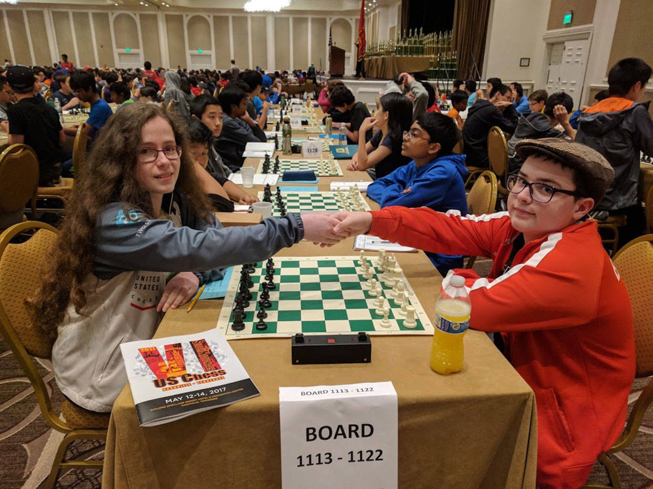World champion chess player and Bellevue resident Naomi Bashkansky (left) shakes hands with an opponent at a chess tournament in Nashville, Tennessee, last weekend. She will be coming to the island Saturday to speak to Chautauqua Elementary School’s chess club and play against willing opponents. (Ludmila Bashkansky Photo)