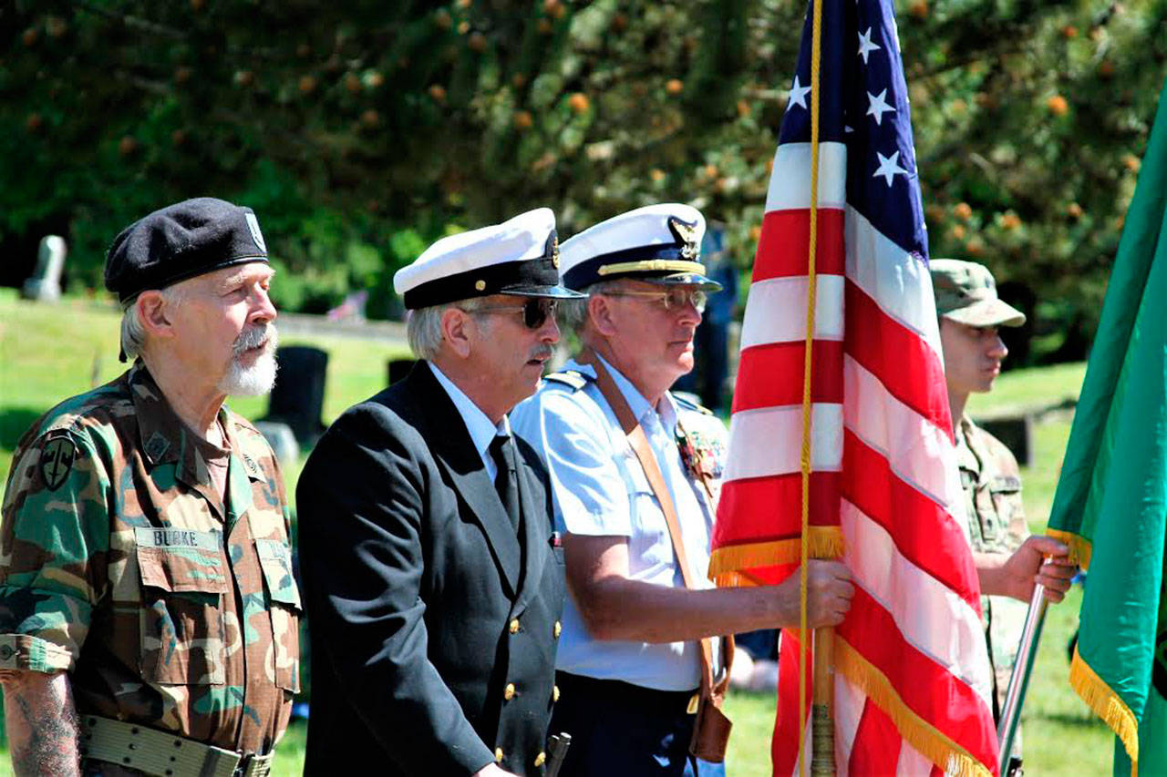 Island veterans participate in the Color Guard at Vashon Cemetery on Memorial Day. (Chris Gaynor Photo)