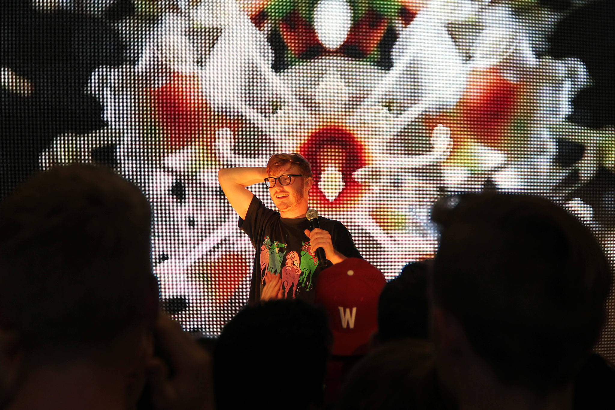 Electronic/dance musician Manatee Commune stands in front of a light screen donated for the event by island company Stageworks Productions during a Friday morning concert at Vashon High School. (Anneli Fogt/Staff Photo)
