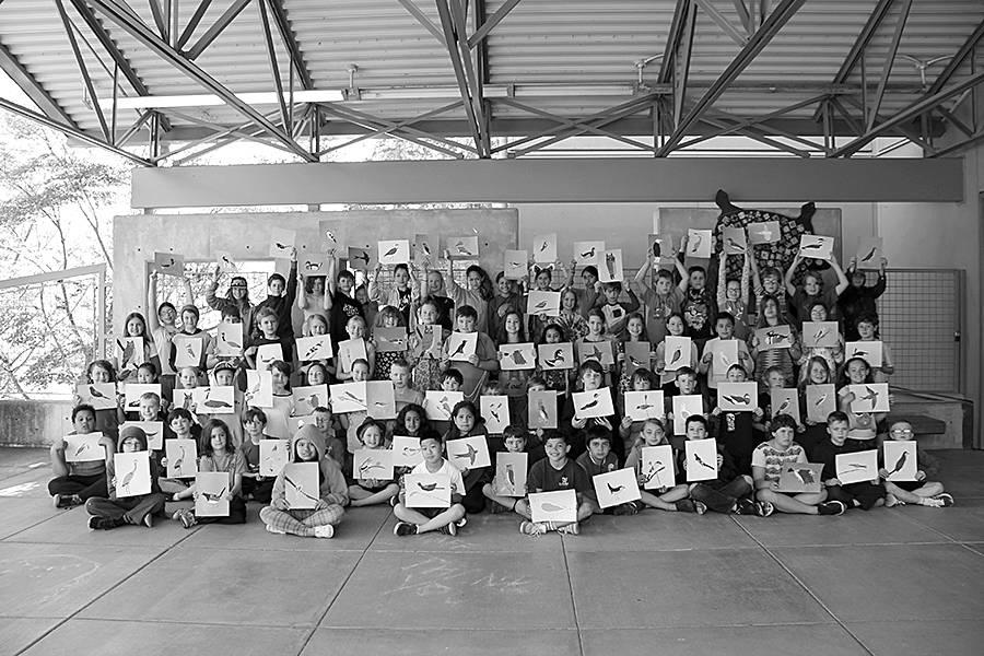 Fourth grade students pose with their artwork at Chautauqua Elementary School. (Juli Goetz Morser Photo)