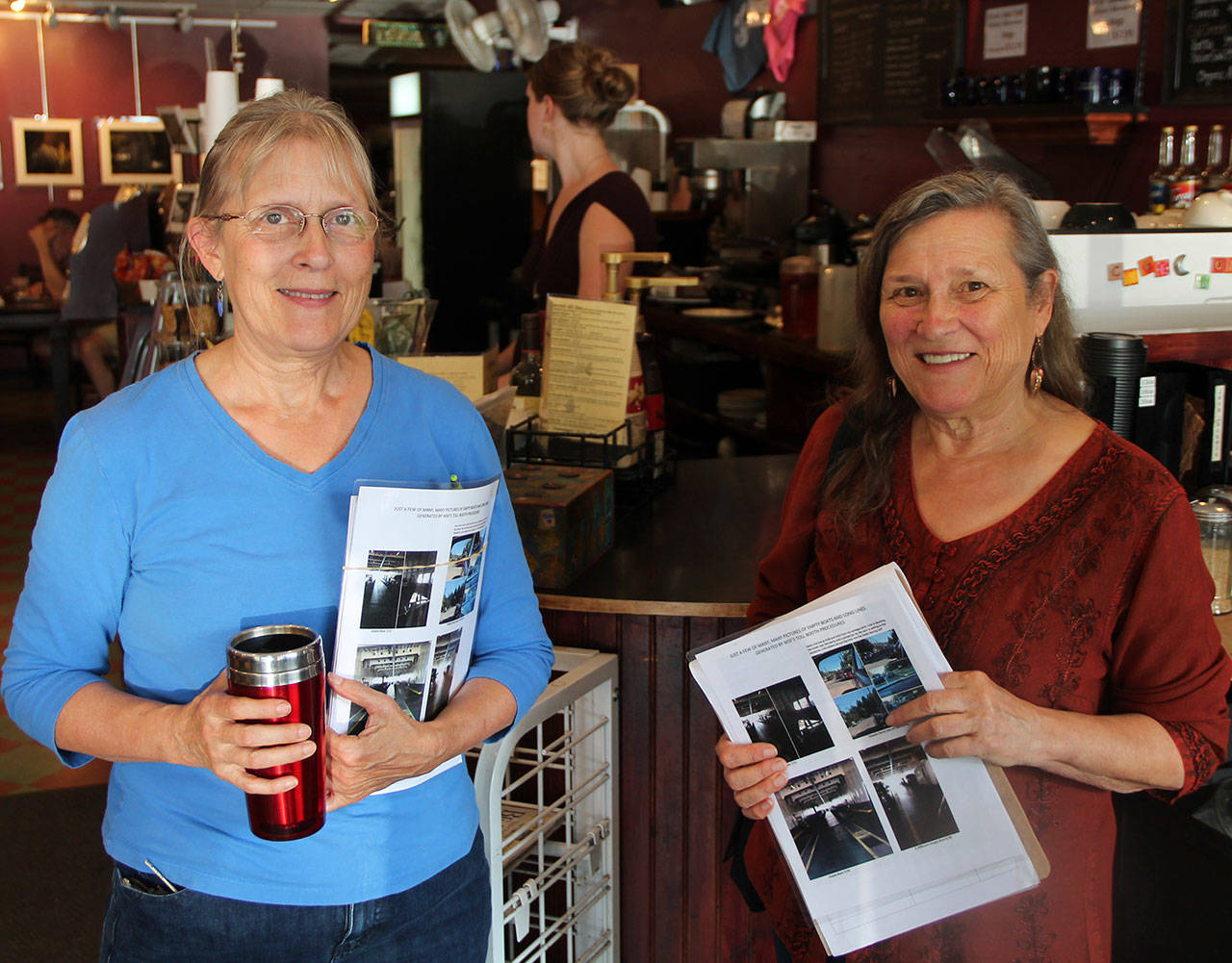 Holly Shull Vogel, left, and Kathy Abascal take a break at Cafe Luna from counting petition signatures. (Courtesy photo)