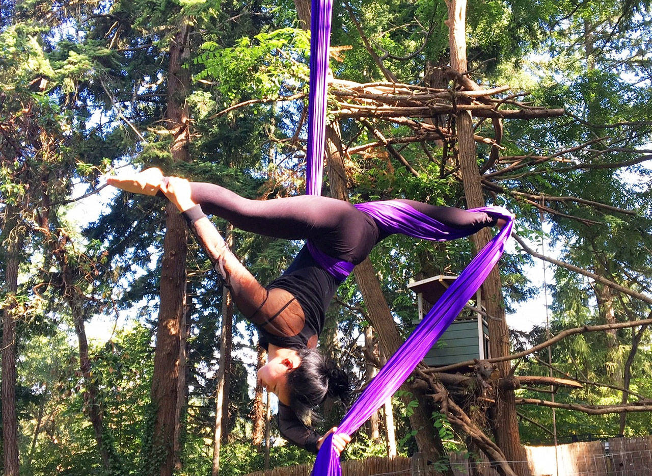 Aly Komarzec performs in Open Air Outdoor Aerial Festival at Open Space for Arts & Community. (Courtesy Photo)                                .