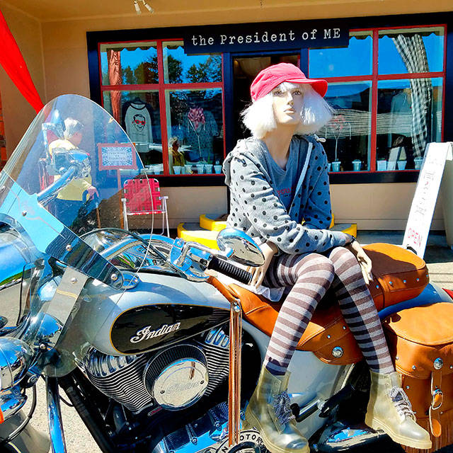 The President of Me mascot Berenice perched on a motorcycle representing her moving on. The store will close Friday, but Wittman will stay on Vashon. (Courtesy Photo)