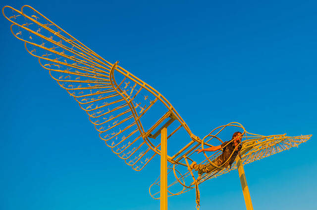 Ela Lambin “flying” in his sculpture created for “Interspecies Communication.” (Leah Mann Photo)