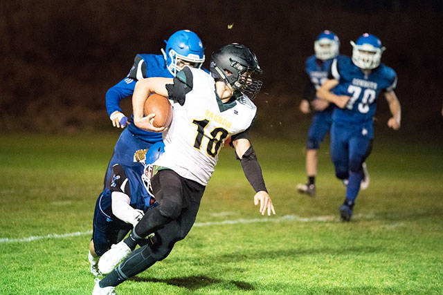 Pirate Connor Hoisington (who was wearing the #10 jersey for the night) finds running room and picks up yardage during a game against the Chimacum Cowboys on Friday in Port Townsend. (Steve Mullensky Photo)