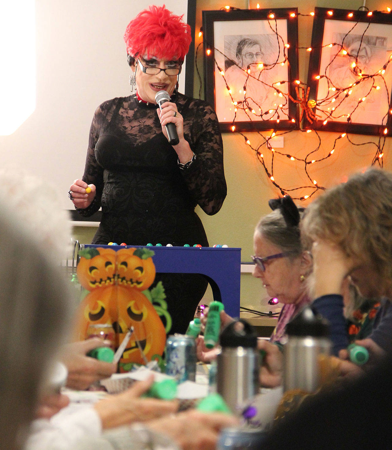 Aunt Betty hosts Vashon Senior Center’s Spooktacular Rainbow Bingo Saturday night. (Anneli Fogt/Staff Photo)
