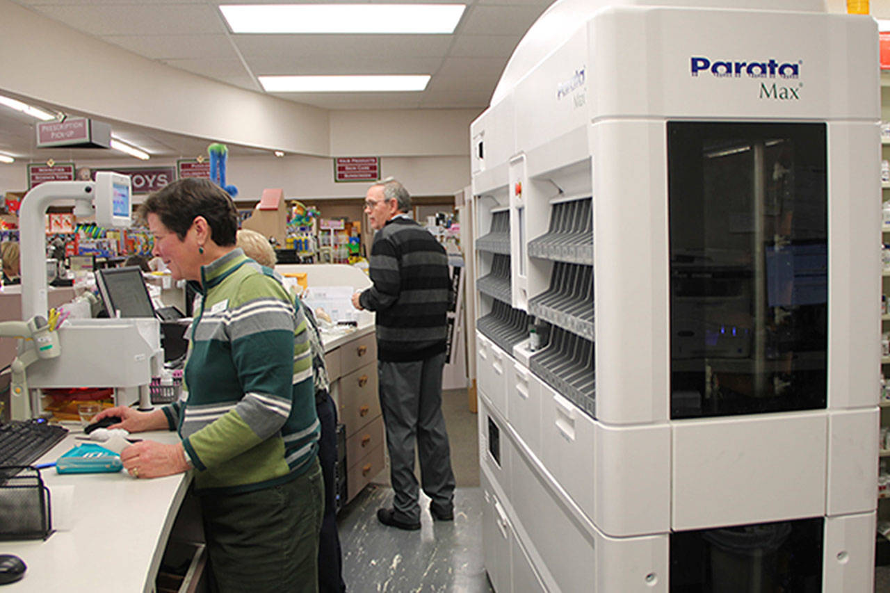 The new machine at the pharmacy is already making a difference, according to owner Tyler Young. (Susan Riemer Staff Photo)