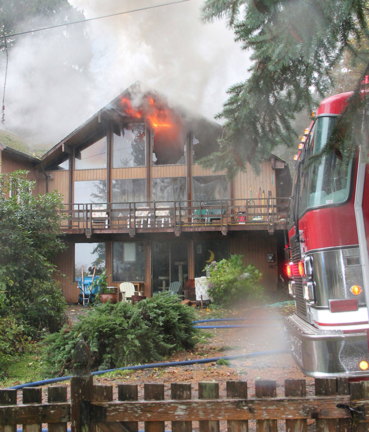 The owner of the home, Kathryn Lehet, returned from Seattle to find her house on fire. (Susan Riemer/Staff Photo)