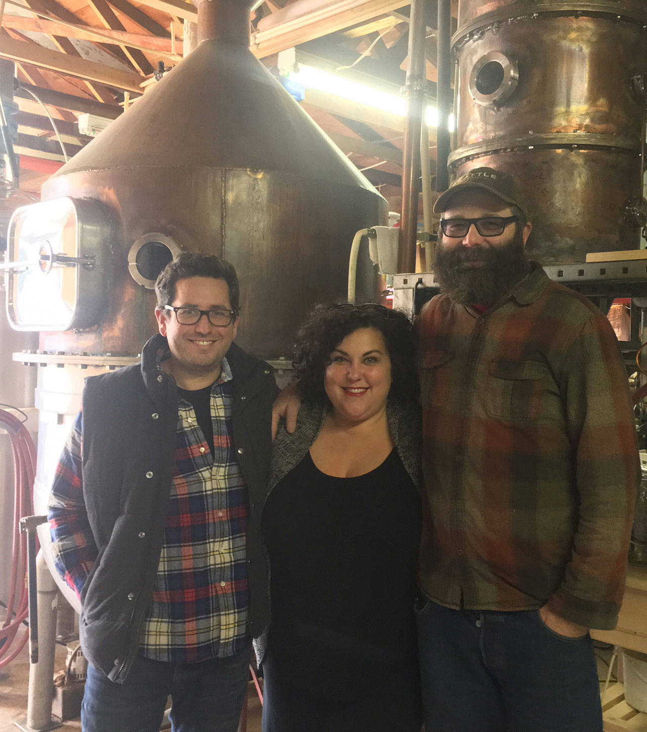 Left to right: Island brewer Matt Lawrence, Seattle Distilling’s Tami Brockway Joyce and Paco Joyce. Lawrence is planning to open a brewery in the former distillery. (Anneli Fogt/Staff Photo)