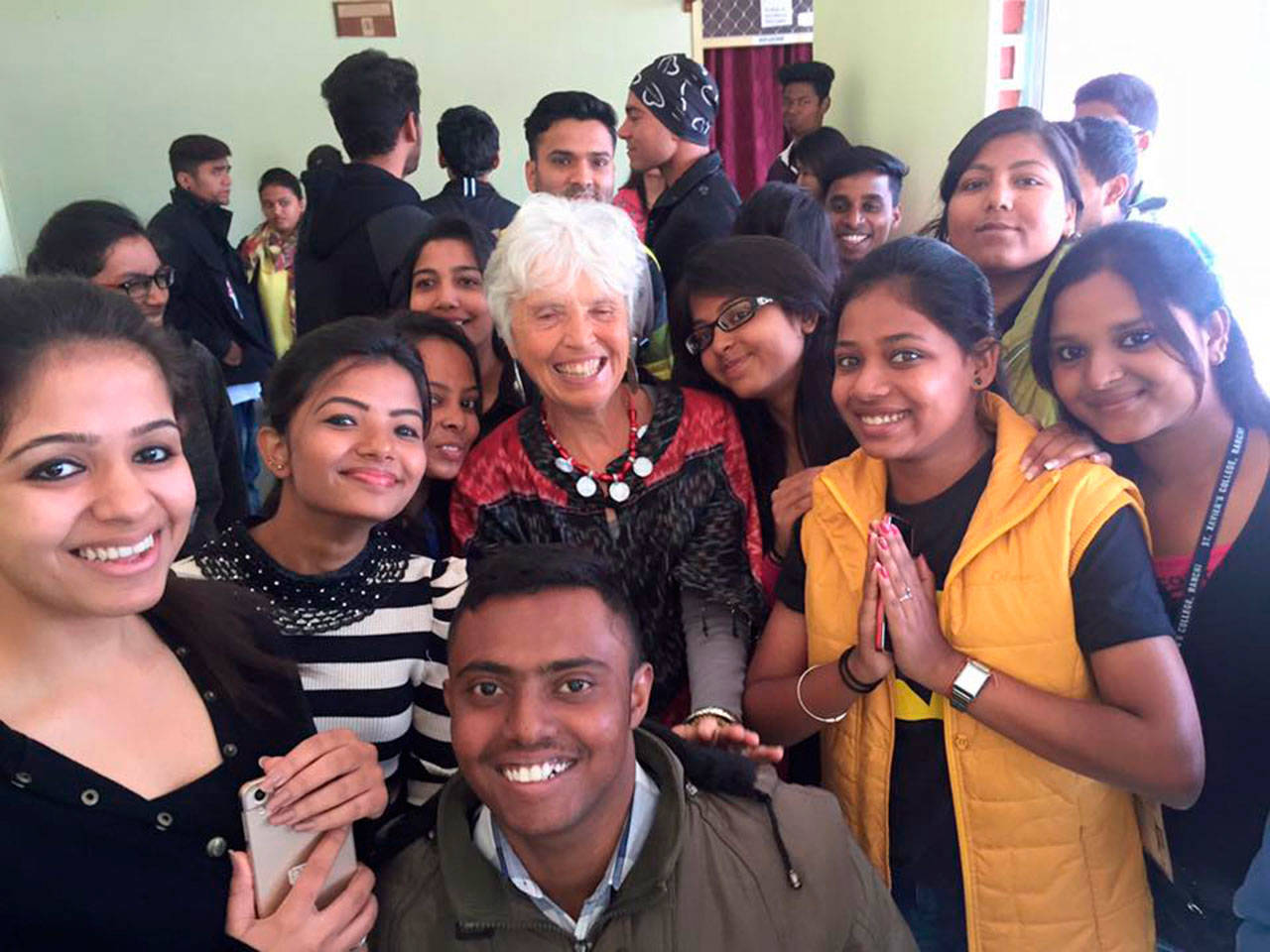 Courtesy Photo                                Betsy Rose is surrounded by students from a college in Ranchi, India.