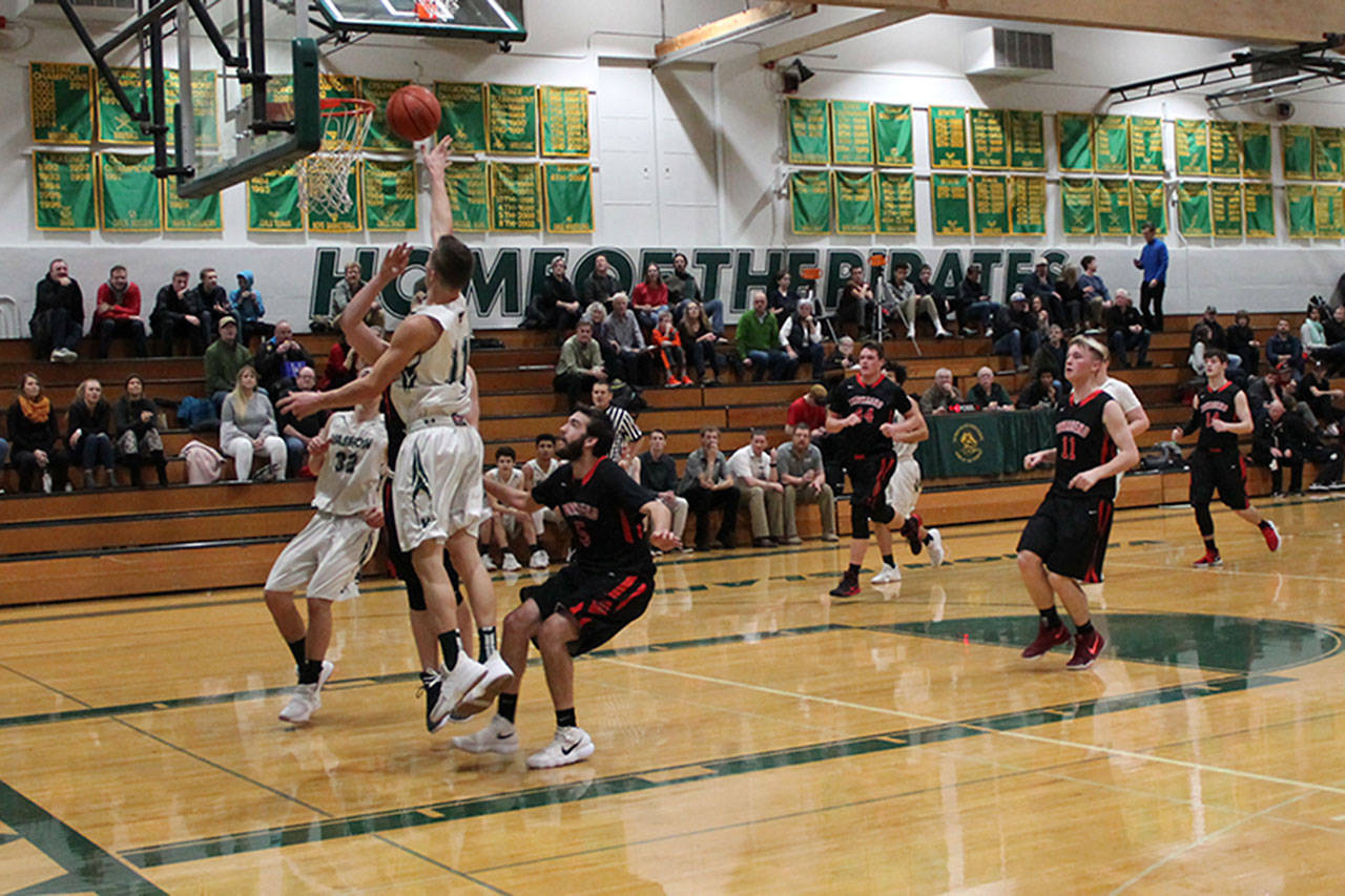 Jahmiah Hoogen, 11, goes up for a shot against Port Townsend at home last week. (Susan Riemer/Staff Photo)