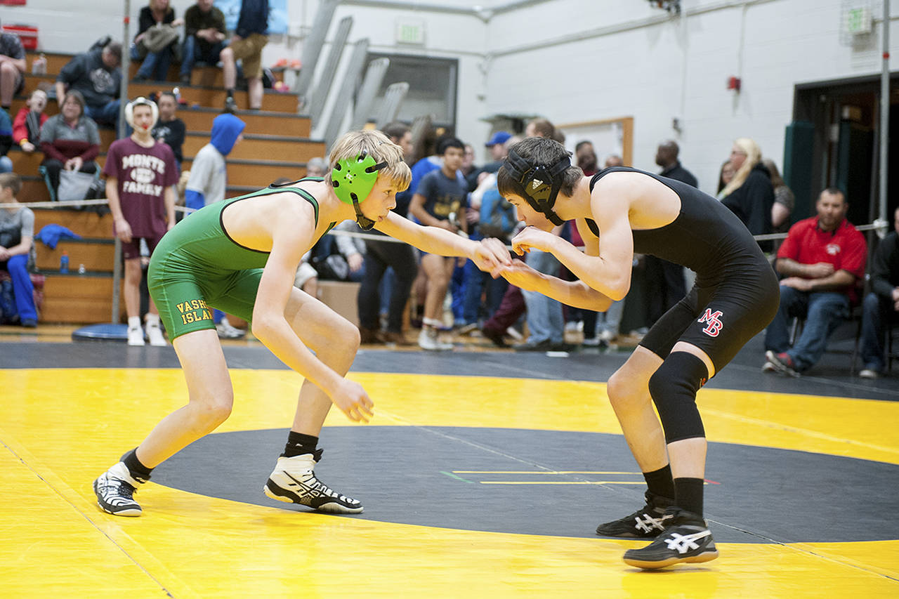 Vashon’s Ethan McIntyre, left, wrestles a Mount Baker opponent in the 106-pound weight class for a third-place finish at the recent tournament. (Sarah Bunch Photo)
