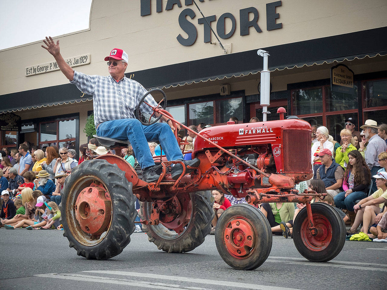 George Nelson drives his tractor in the Strawberry Festival parade of 2013