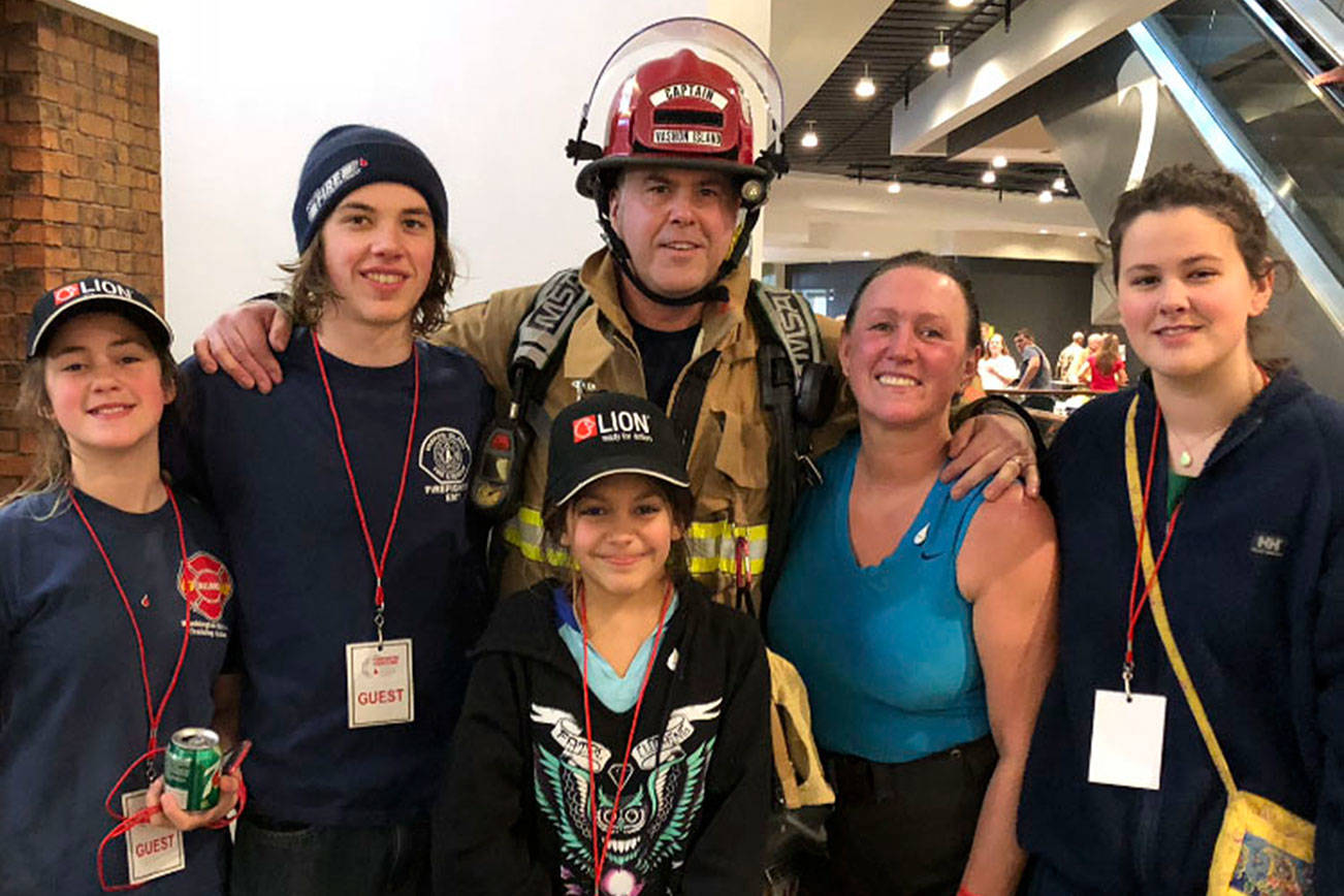 Firefighter climbs Columbia Center tower with wife, battling cancer