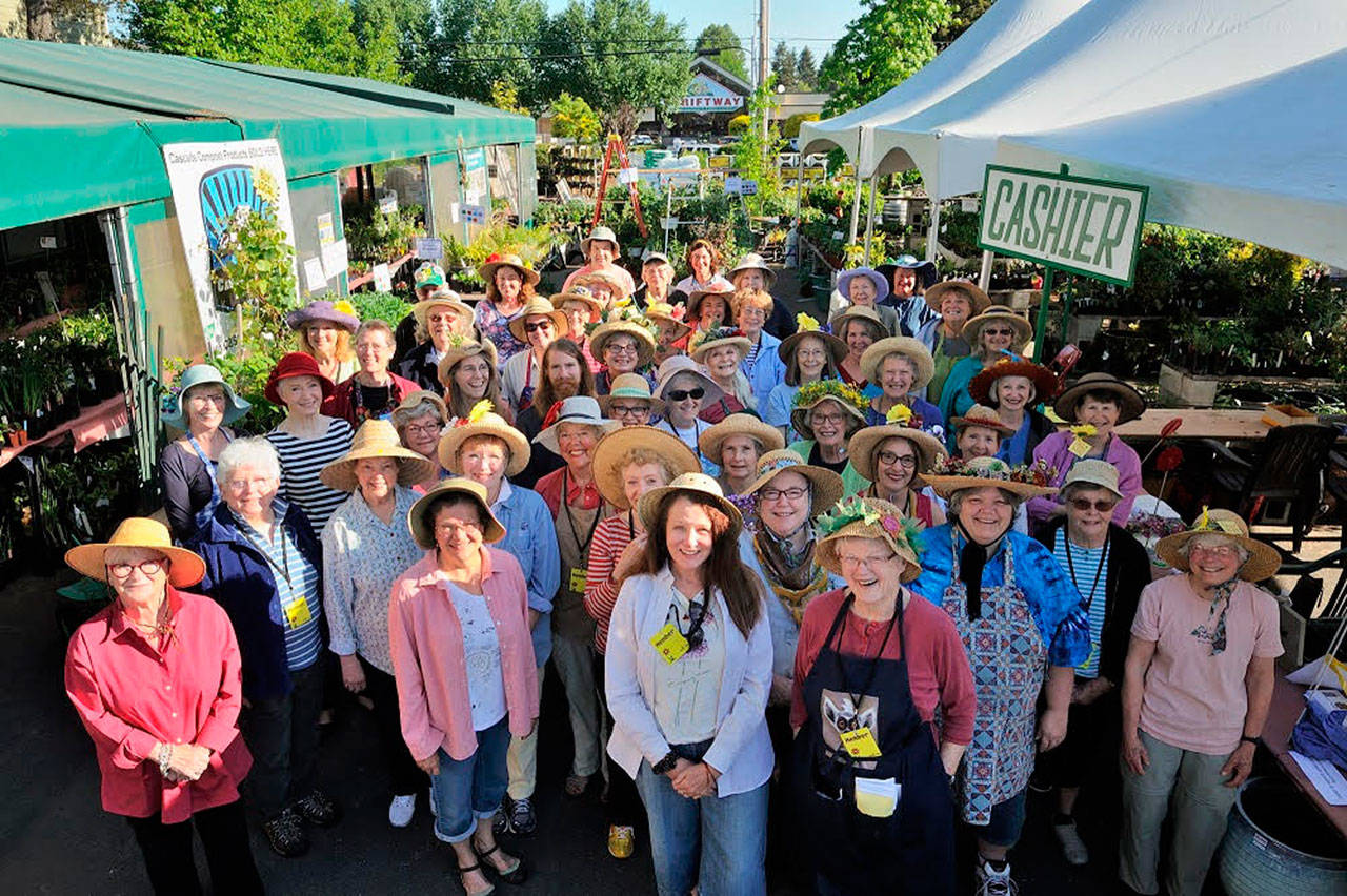 Vashon-Maury Island Garden Club members — and their hats — out in force in support of the group’s annual plant sale. (Courtesy Photo)