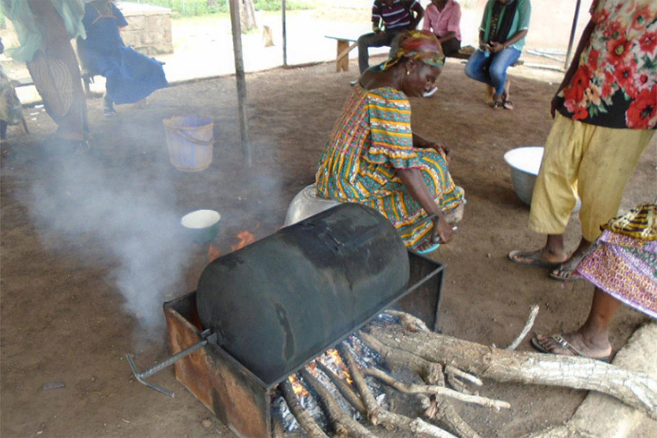 Burn Design Lab is working with a group in Ghana to create a better woodburning stove. Members of the group make shea butter from roasted shea nuts. (Burn Design Lab Photo)