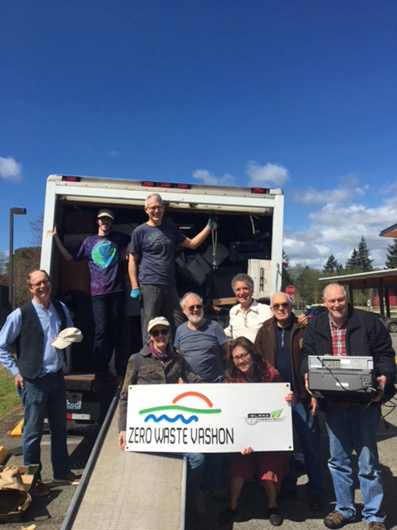 At the Earth Day event in April, ZWV board members complete loading the truck with e-cycling for transport off-island to SBK-Green Century Electronic Recycling located in Tacoma. (Courtesy Photo)