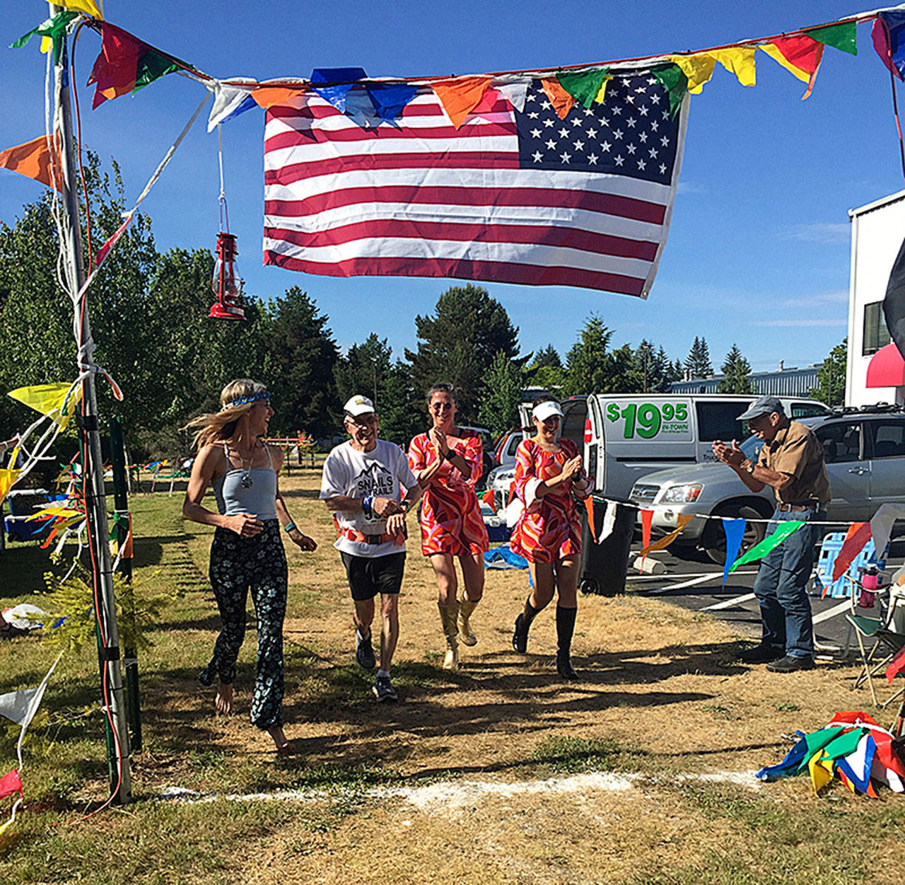 Bob Norton and The Dancing Queens at the finish line. (Courtesy Photo)