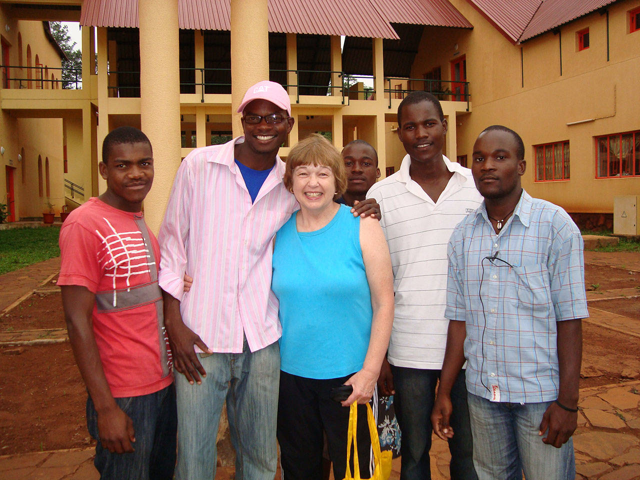 Courtesy Photo                                Georgia Hartness, center, with English students in Namaacha, Mozambique, on a visit with her son during his Peace Corps assignment in 2009.