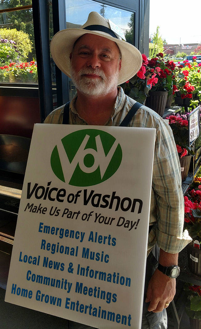 Rick Wallace, taking a break from selling Voice of Vashon raffle tickets at Thriftway last week, is well known for his volunteer efforts (Courtesy Photo).