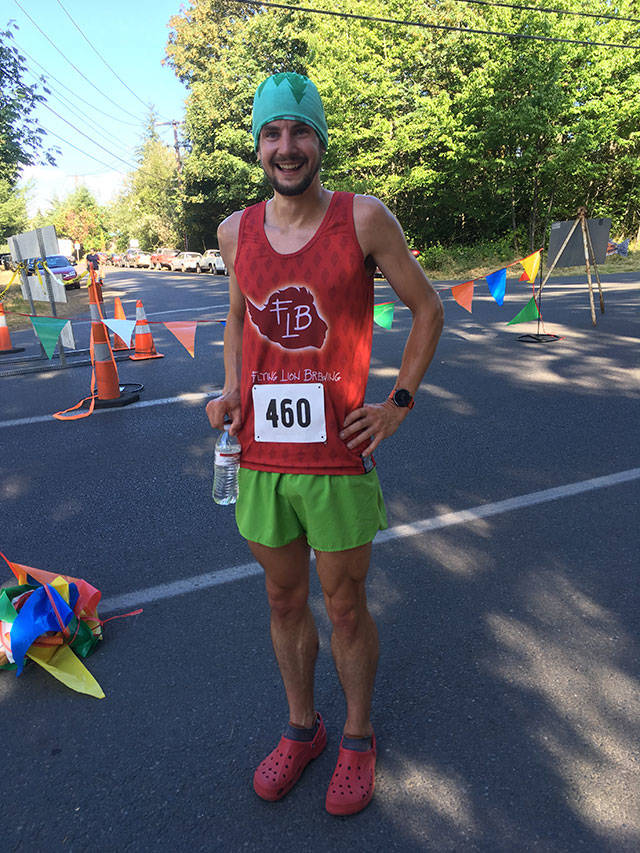 Evan Williams is all smiles after winning the 10k on Saturday, dressed as a strawberry and wearing Crocs (Mary Margaret Briggs Photo).