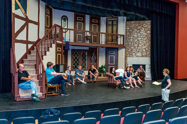Director Susan Hanson and the cast of “Noises Off” take a break from rehearsal on the show’s two-story set (John de Groen Photo).