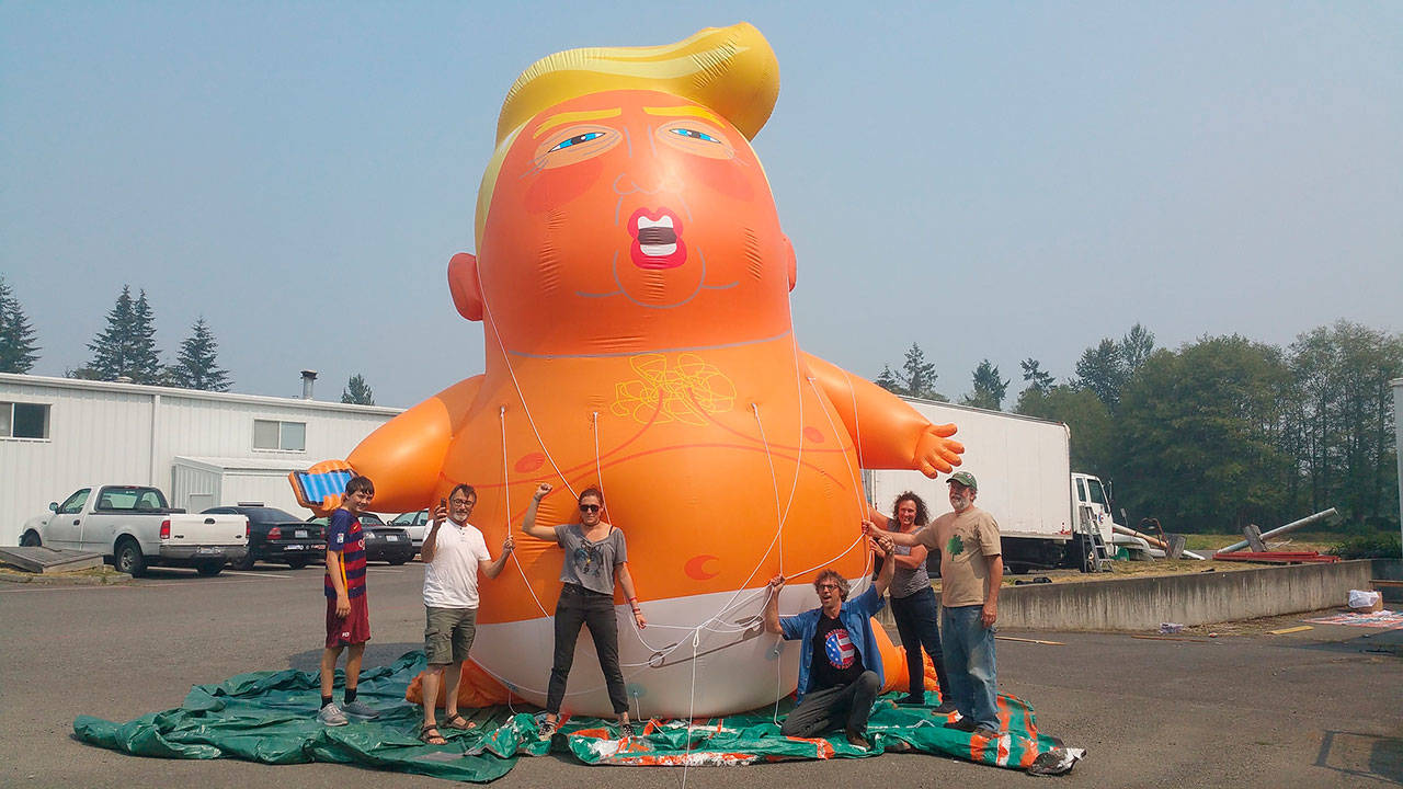 Members of the Backbone Campaign pose with the “Trump Baby” balloon after Washington residents independently fundraised to have one brought to the state and loaned it to the organization (Courtesy Photo).